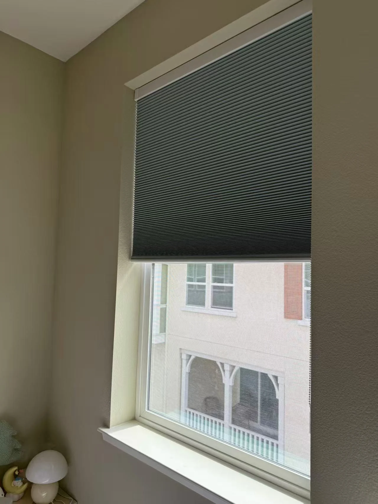 Honeycomb cellular shade installed on a residential window