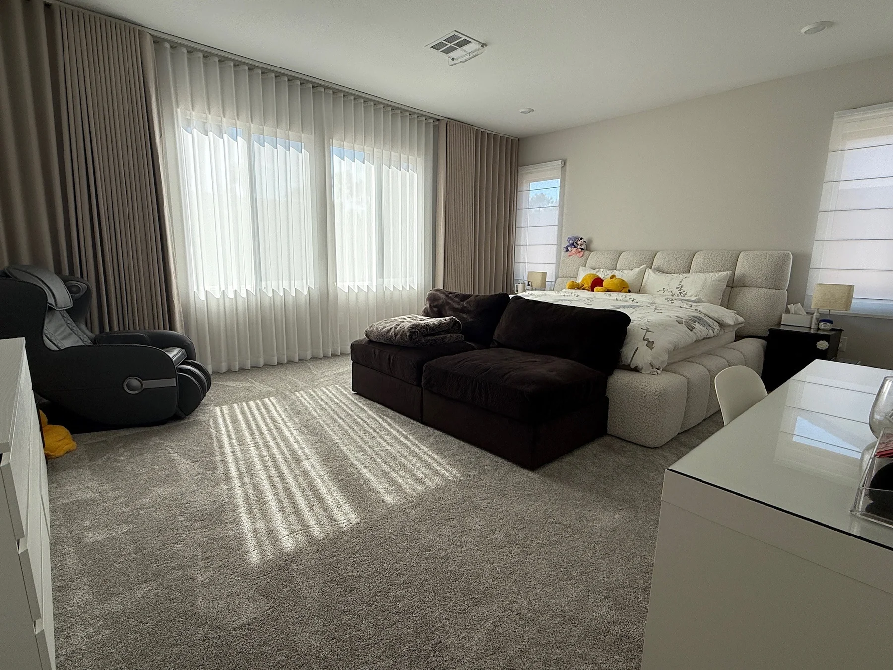 Layered drapery and sheers in a bedroom